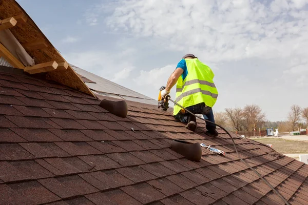 depositphotos_160685324-stock-photo-construction-worker-putting-the-asphalt